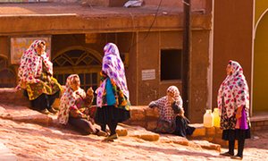 Iranian womens in the village of Abyaneh, Iran. the women are wearing colourful headscarves.