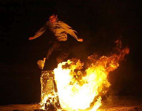 Jumping over fire at Chaharshanbeh Soori