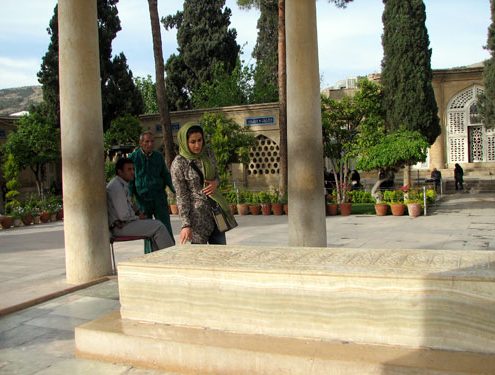 Iranian woman praying at Hafez tomb